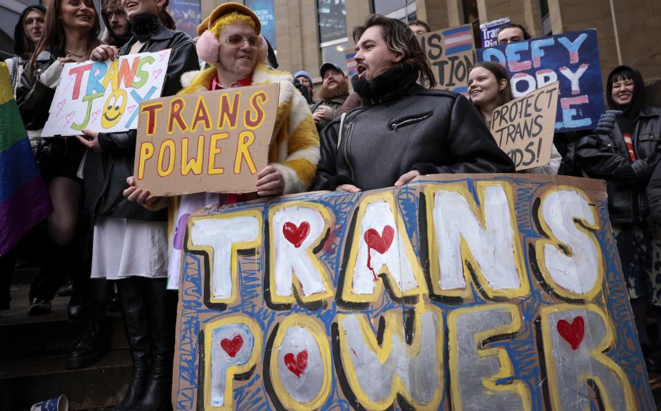 Trans rights demonstrators at a rally in Glasgow in January - Jeff J Mitchell/Getty Images