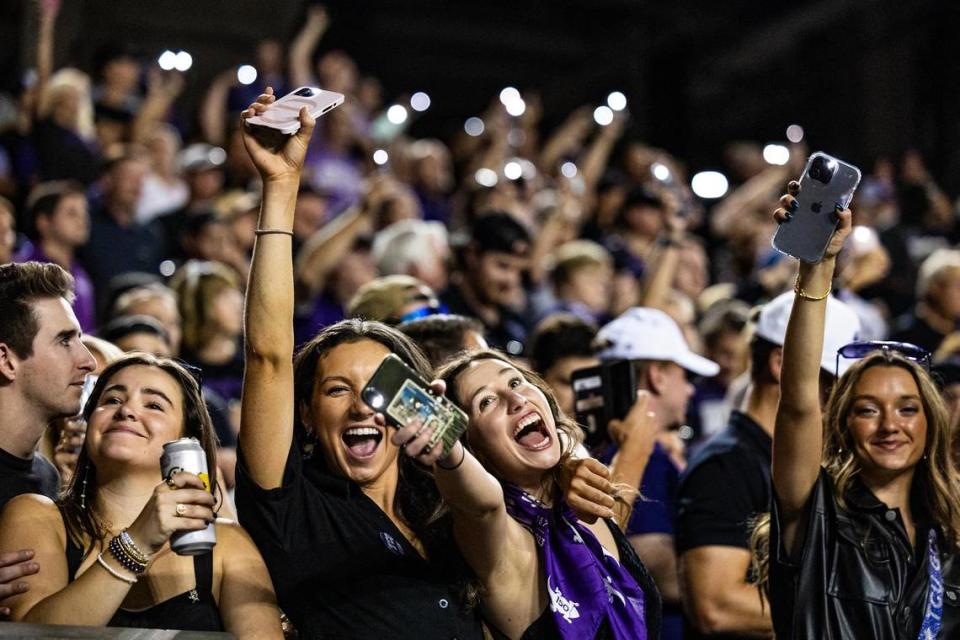 TCU fans put up their phone flashlights to ‘light up the night’ for a Big XII conference game between the TCU Horned Frogs and the West Virginia Mountaineers at Amon G. Carter Stadium in Fort Worth on Saturday, Sept. 30, 2023. Chris Torres/ctorres@star-telegram.com