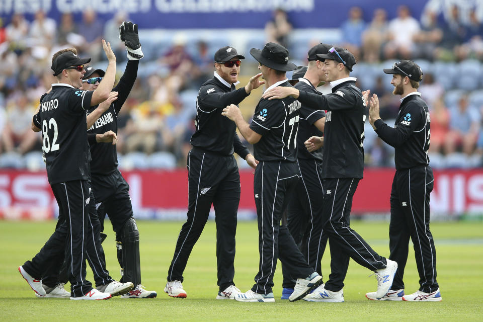 New Zealand's players celebrate after taking the wicket of Sri Lanka's Kusal Perera during the ICC Cricket World Cup group stage match in Cardiff, Wales, Saturday June 1, 2019. (Nigel French/PA via AP)