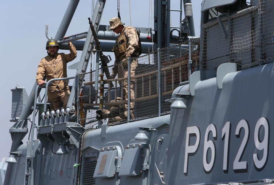 German navy U.N. peacekeepers, stand on their vessel, as they await the arrival of the German Defense Minister Ursula von der Leyen, in the seaport of Beirut, Lebanon, Thursday, April 24, 2014. Leyen is in Lebanon to meet with Lebanese officials and to visit the German UNIFIL navy troops. Germany has been a contributor since 2006 to the UNIFIL maritime mission in Lebanon which aims at supporting the Lebanese navy in securing Lebanon’s maritime borders. (AP Photo/Hussein Malla)