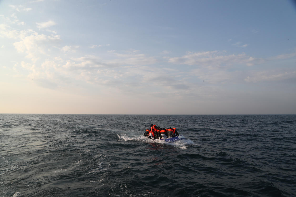 A group of people thought to be migrants crossing The Channel in a small boat headed in the direction of Dover, Kent. (Photo by Gareth Fuller/PA Images via Getty Images)