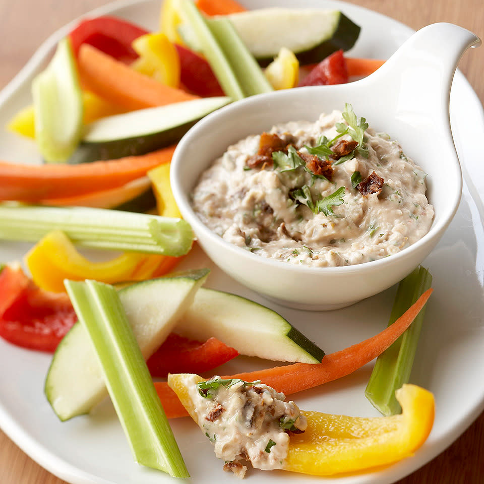 <p>This creamy appetizer dip uses beans rather than sour cream or mayonnaise, so it's high in flavor but low in fat and calories. <a href="https://www.eatingwell.com/recipe/264238/tomato-ranch-bean-dip/" rel="nofollow noopener" target="_blank" data-ylk="slk:View Recipe" class="link ">View Recipe</a></p>