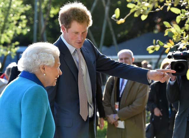 Harry with his grandmother the Queen at the Chelsea Flower Show in 2015