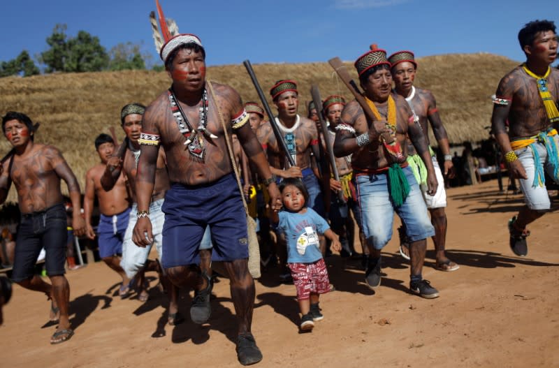Indigenous people of Yudja tribe, perform a greeting dance during a four-day pow wow in Piaracu village, in Xingu Indigenous Park, near Sao Jose do Xingu, Mato Grosso state