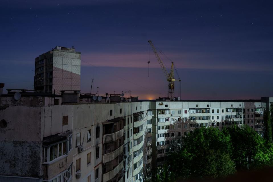 The night landscape of the neighborhood of Saltivka that has endured relentless bombardment by the Russian forces since the beginning of the full-scale invasion, especially during the battle of Kharkiv in 2022, in Kharkiv, Ukraine on April 23, 2024. (Serhii Korovayny/The Kyiv Independent)