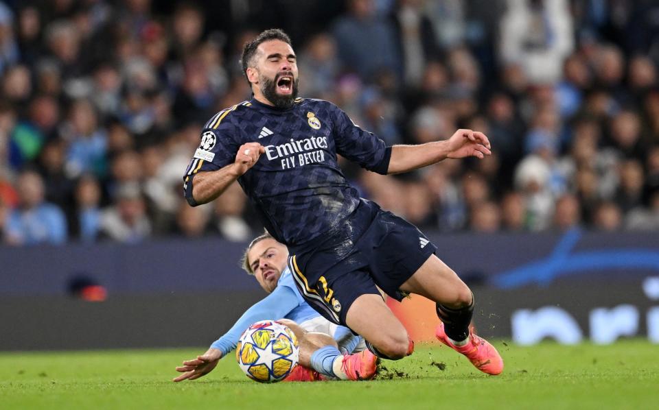 Jack Grealish fouls Dani Carvajal