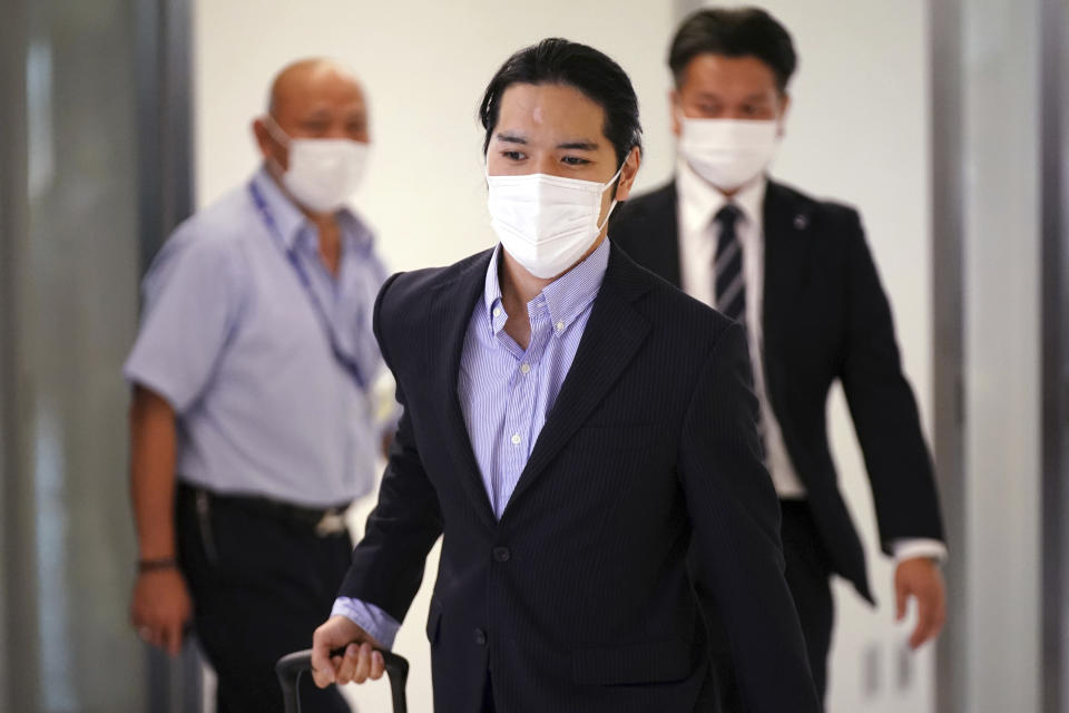 Kei Komuro, fiance of Japan's Princess Mako, arrives at Narita international airport in Narita, near Tokyo, Monday, Sept. 27, 2021 upon returning to Japan from the United States. (AP Photo/Eugene Hoshiko)