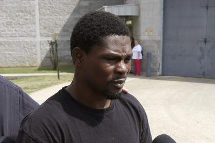 Boxer Jermain Taylor walks from the Pulaski County Jail in Little Rock, Ark., after spending the night there Aug. 27. (AP)