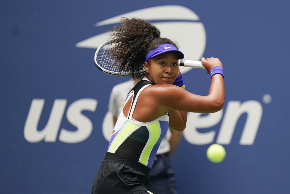 FILE - Naomi Osaka, of Japan, returns a shot to Victoria Azarenka, of Belarus, during the women's singles final of the U.S. Open tennis championships in New York, in this Saturday, Sept. 12, 2020, file photo. Osaka's first Grand Slam action since she withdrew from the French Open following a first-round victory to take a mental health break will come against Marie Bouzkova, a 23-year-old from the Czech Republic who is ranked 86th and has a 1-10 career record at the majors, including 0-3 at Flushing Meadows. (AP Photo/Seth Wenig, File)