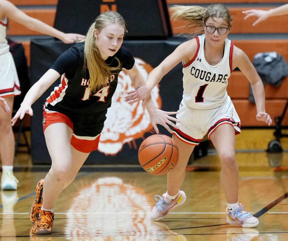 Howard's Abby Aslesen and Viborg-Hurley's Estelle Lee chase after a loose ball during their first-round game in the state Class B high school girls basketball tournament on Thursday, March 9, 2023 in the Huron Arena. Viborg-Hurley won 64-46.