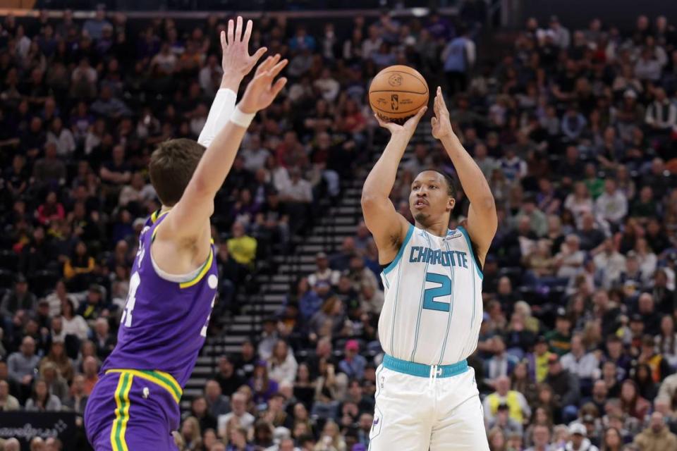 Charlotte Hornets forward Grant Williams (2) shoots the ball over Utah Jazz center Walker Kessler (24) during the second half at Delta Center.