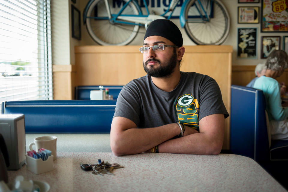 Harpreet Singh Saini, who lost his mother in the Oak Creek&nbsp;massacre, sits in the Douglas Avenue Diner in Racine, Wisconsin. (Photo: Darren Hauck for HuffPost)