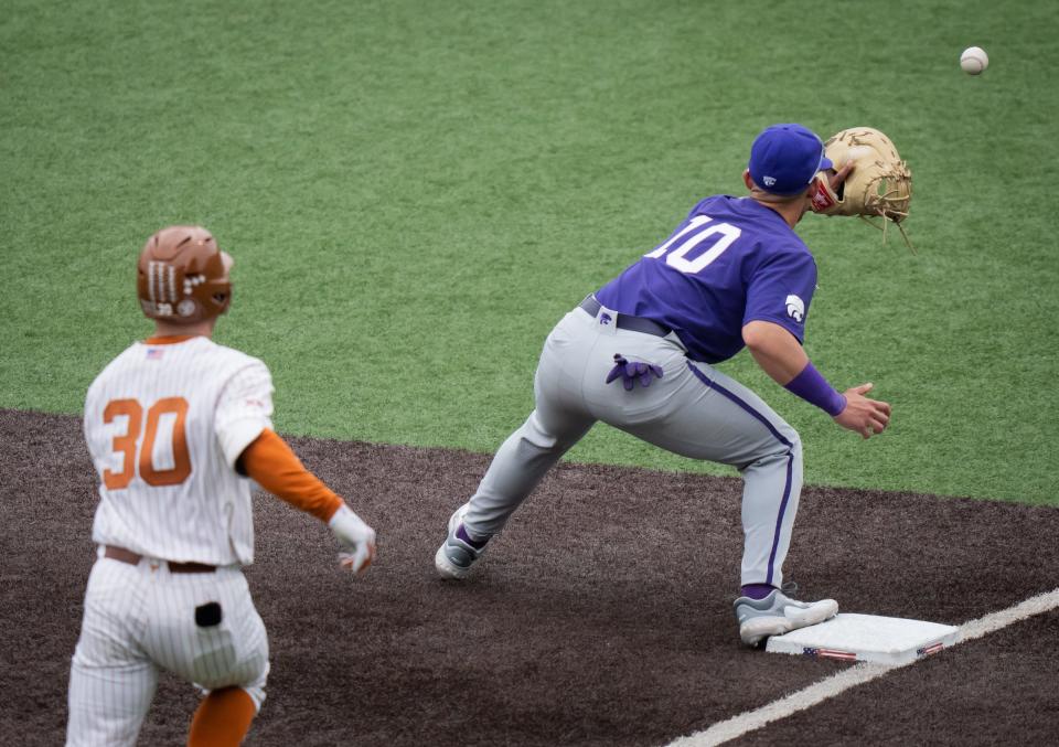 Texas' Eric Kennedy sprints toward first base as Kansas State infielder Roberto Pena makes the catch during their April 8 matchup at UFCU Disch-Falk Field, a 6-5 Wildcats win. Kansas State again dropped Texas on Thursday, this time in an elimination game at the Big 12 Tournament in Arlington. The Wildcats won 6-0.
