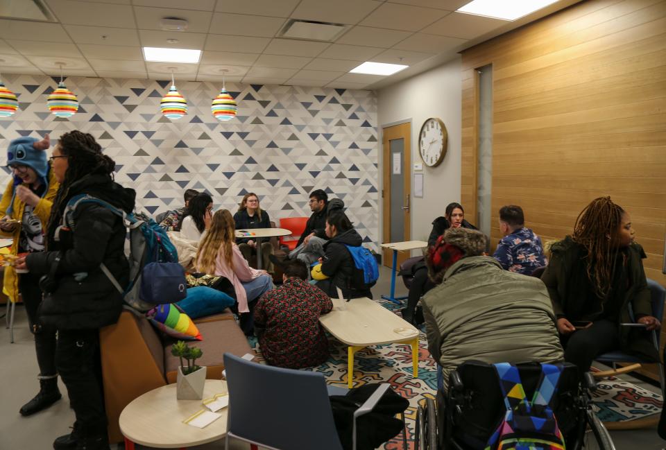 Students gather at Purdue University's newest LGBTQ Center at the Hicks Undergraduate Library to celebrate its grand opening, on Friday, Jan. 27, 2023, in West Lafayette, Ind.