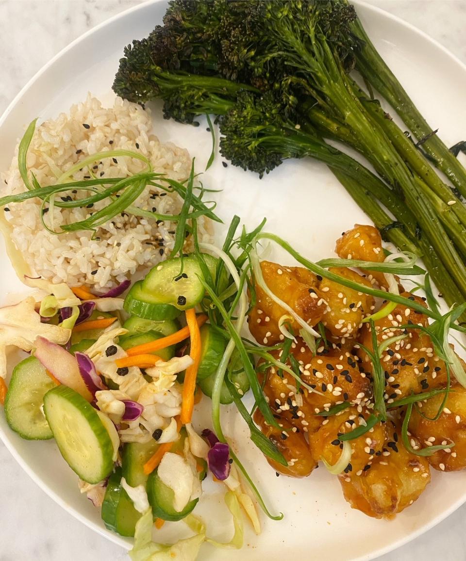 Kung Pao Cauliflower Tempura with rice and slaw.