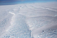 <p>Sections of blue ice are viewed from NASA’s Operation IceBridge research aircraft, in the Antarctic Peninsula region on Oct. 31, 2017, above Antarctica. (Photo: Mario Tama/Getty Images) </p>