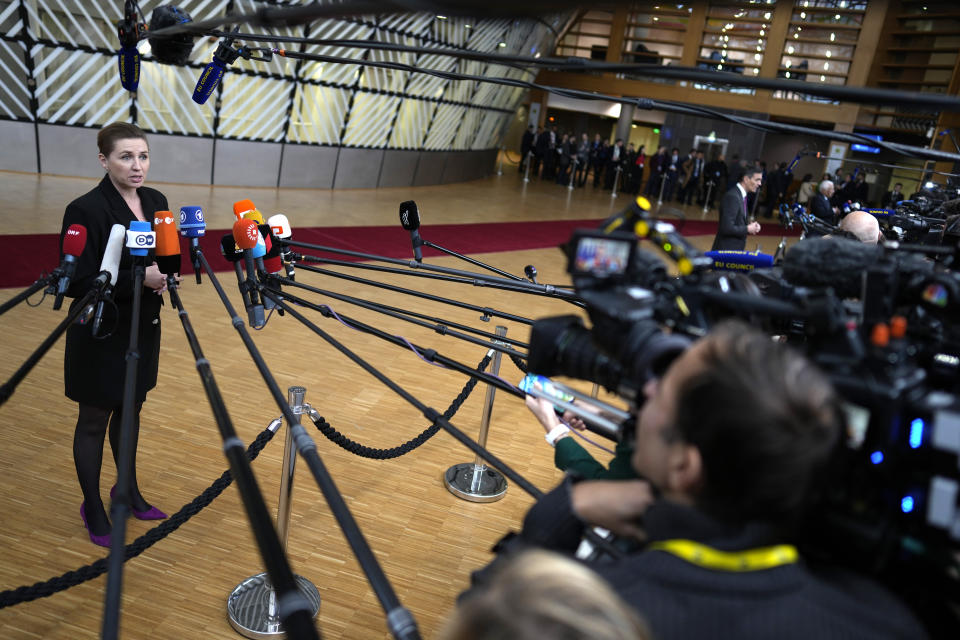 Denmark's Prime Minister Mette Frederiksen speaks with the media as she arrives for an EU summit at the European Council building in Brussels, Thursday, Dec. 14, 2023. European Union leaders, in a two-day summit will discuss the latest developments in Russia's war of aggression against Ukraine and continued EU support for Ukraine and its people. (AP Photo/Virginia Mayo)