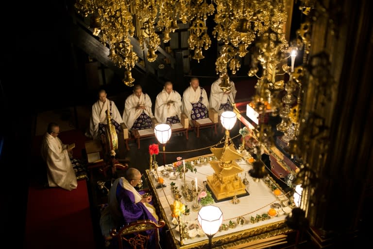 Buddhist priests attend a prayer session inside Saidaiji temple during the annual Naked Man Festival or 'Hadaka Matsuri' in Okayama, western Japan