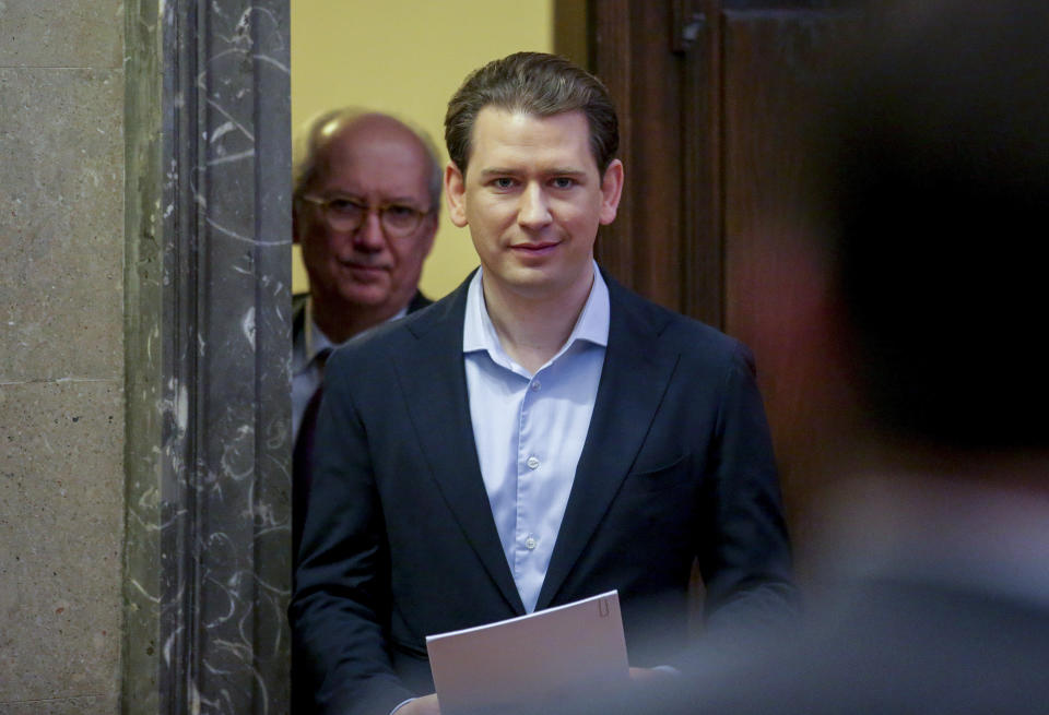 Former Austrian Chancellor Sebastian Kurz, right, and his lawyer Walter Suppan appear at court for the expected verdict of his trial in Vienna, Austria, Friday, Feb.23, 2024. Kurz is charged with having allegedly making false statements to a parliamentary inquiry into alleged corruption in his first government. (AP Photo/Heinz-Peter Bader)