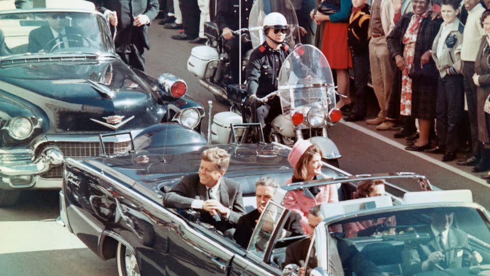 The president rides with first lady Jacqueline Kennedy in Dallas on November 22, 1963. Bullets put an end to his evolution on matters of racial justice. - Bettmann Archive/Getty Images