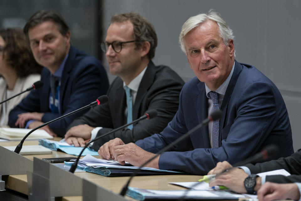 European Union chief Brexit negotiator Michel Barnier, right, sits along with his team during a meeting with Britain's Brexit Secretary Stephen Barclay at the European Commission headquarters in Brussels, Friday, Sept. 20, 2019. (Kenzo Tribouillard/Pool via AP)