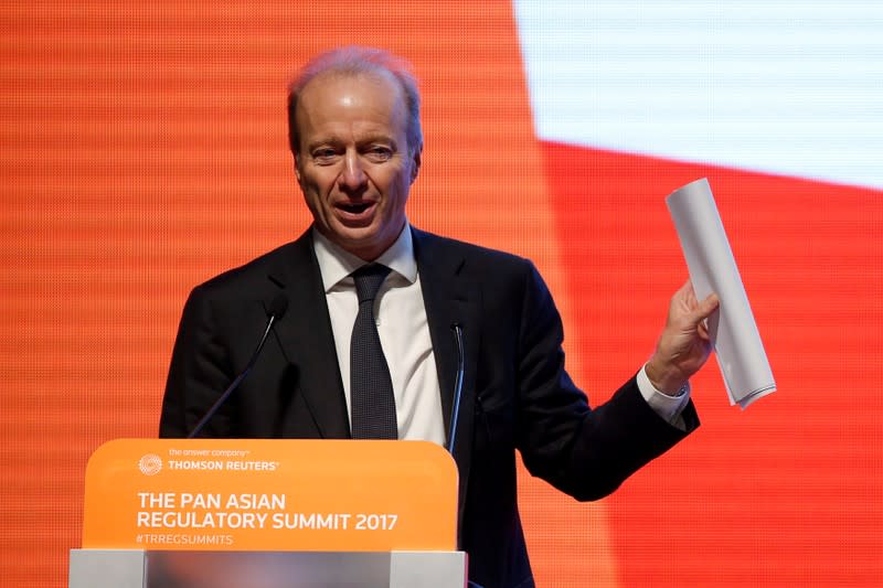 FILE PHOTO: Ashley Alder, Chief Executive Officer of Hong Kong Securities and Futures Commission, addresses a summit in Hong Kong in 2017