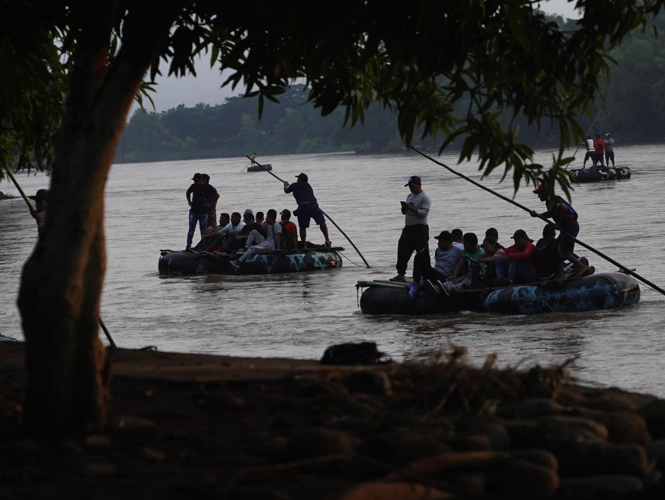 Venezuelan migrants cross the Suchiate river, the border between Guatemala and Mexico, near Ciudad Hidalgo, Chiapas state, Mexico, Tuesday, Oct. 4, 2022. The Biden administration has agreed to accept up to 24,000 Venezuelan migrants at U.S. airports, while Mexico has agreed to take back Venezuelans who come to the U.S. illegally over land. Effective immediately, those who walk or swim across the border will be immediately returned to Mexico under a pandemic rule known as Title 42 authority, which suspends rights to seek asylum under U.S. and international law on grounds of preventing the spread of COVID-19. (AP Photo/Marco Ugarte)