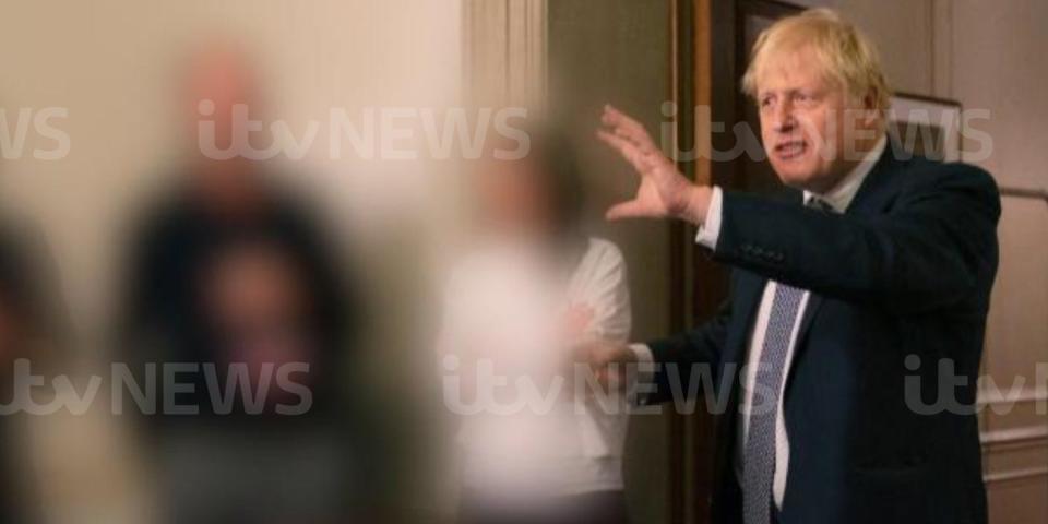 Boris Johnson talks to attendees of a lockdown-breaching gathering