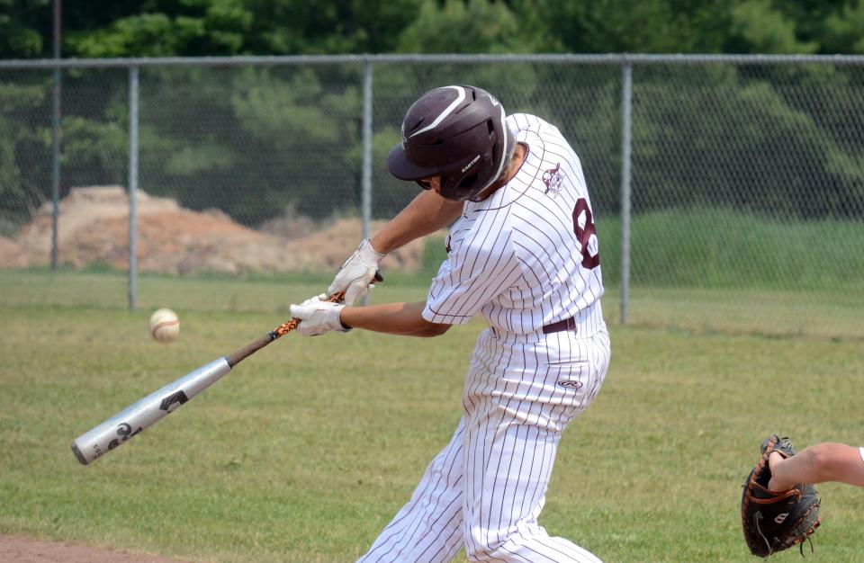Charlevoix's AJ Speigl sends a shot to the outfield during Saturday's district tournament in Charlevoix.