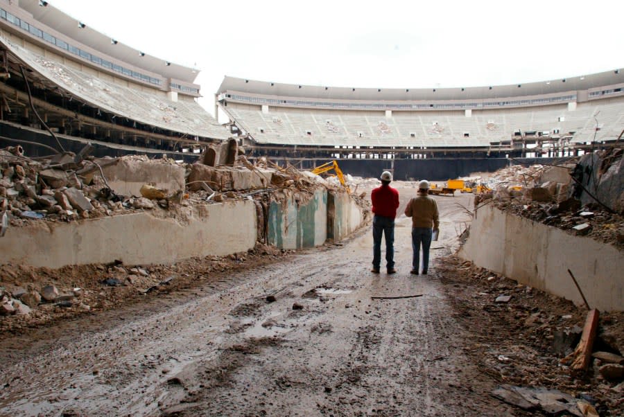 Mike DiMuzio, left, Phillies director of ballpark operations, and Jim Santoro, demolition project manager, oversee final preparations at Philadelphia’s Veterans Stadium Wednesday, March 17, 2004, for its impending implosion. The stadium, home to Philadelphia sports teams from 1971-2003, will be imploded Sunday, March 21. The process will take about 58 seconds. (AP Photo/Miles Kennedy)