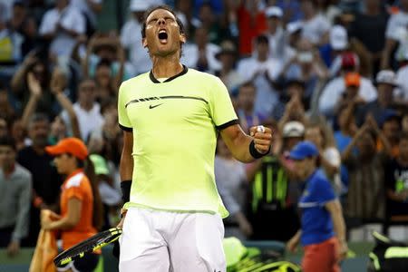 Mar 26, 2017; Miami, FL, USA; Rafael Nadal of Spain celebrates after his match against Philip Kohlschreiber of Germany (not pictured) on day six of the 2017 Miami Open at Crandon Park Tennis Center. Nadal won 0-6, 6-2, 6-3. Geoff Burke-USA TODAY Sports