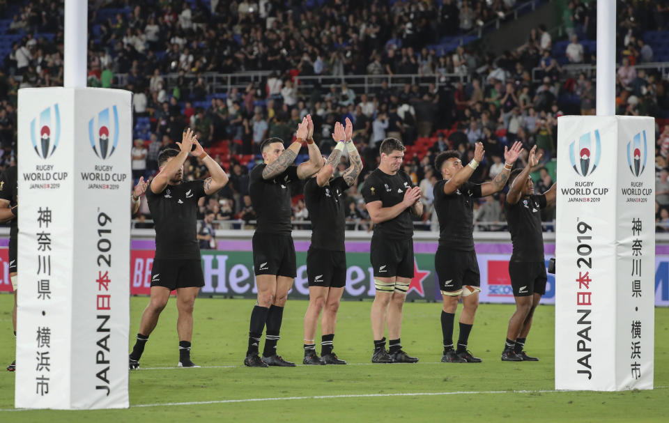 New Zealand's rugby team players clap to the crowd after winning against South Africa during their match at the Rugby World Cup Pool B game in Yokohama, Japan, Saturday, Sept. 21, 2019. (AP Photo/Koji Sasahara)