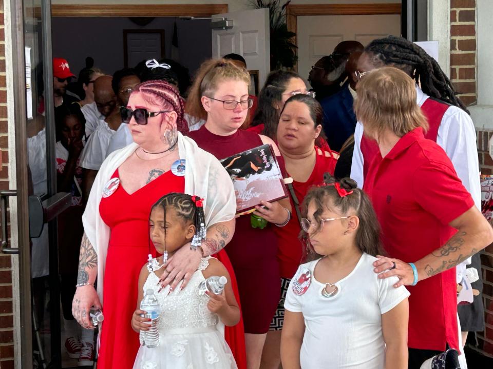 Carrie Friar, left in sunglasses, is escorted by family as she leaves Metropolitan Baptist Church in Petersburg Thursday, June 29, 2023. The church was the site of her son K'Von Morgan's funeral service. K'Von was shot to death June 17 in his bedroom at Petersburg's Pecan Acres.