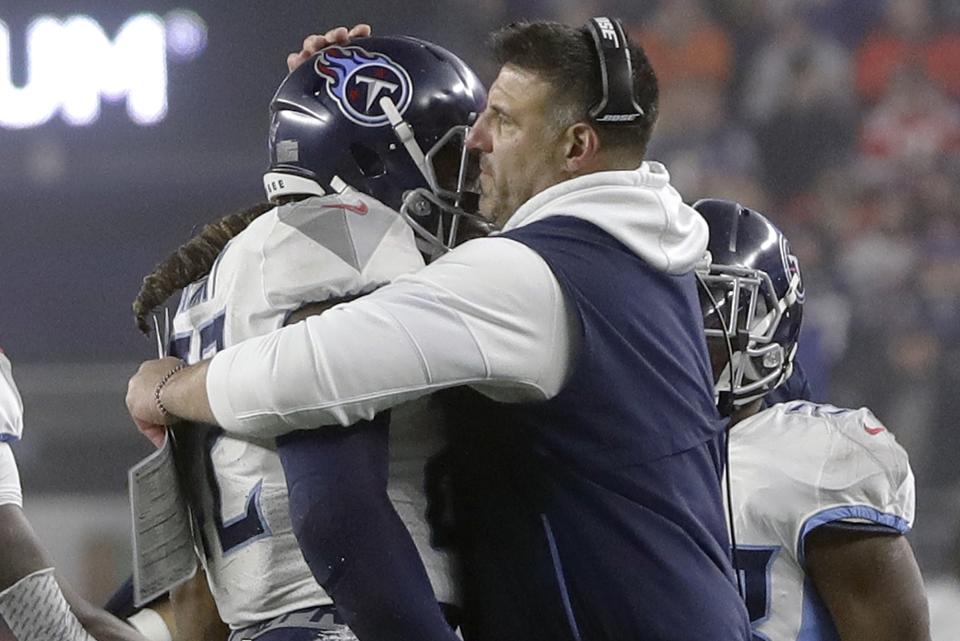 Tennessee Titans head coach Mike Vrabel, right, congratulates running back Derrick Henry after his touchdown dive in the first half of an NFL wild-card playoff football game against the New England Patriots, Saturday, Jan. 4, 2020, in Foxborough, Mass. (AP Photo/Steven Senne)