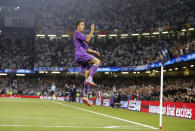 FILE - In this Saturday June 3, 2017 file photo Real Madrid's Cristiano Ronaldo celebrates after scoring the opening goal during the Champions League final soccer match between Juventus and Real Madrid at the Millennium stadium in Cardiff, Wales. Neither Lionel Messi nor Cristiano Ronaldo will be in the Champions League quarterfinals for the first time since 2005. The two greatest players of the current generation were both eliminated from the competition this week. Messi scored a goal but missed a penalty as Barcelona was eliminated by Paris Saint-Germain. Ronaldo and his Juventus teammates were ousted by Porto the night before. Ronaldo has won five Champions League titles in his career. Messi has won four. (AP Photo/Frank Augstein, File)