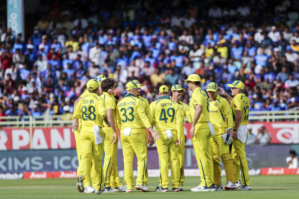 Australian players celebrate the wicket of India's Kuldeep Yadav during the second one-day international cricket match between India and Australia, in Visakhapatnam, India, Sunday, March 19, 2023. (AP Photo/Surjeet Yadav)