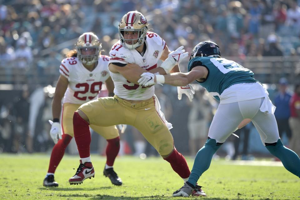 Jacksonville Jaguars tight end Dan Arnold works against San Francisco 49ers defensive end Nick Bosa.