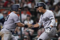 New York Yankees' Oswaldo Cabrera, right, celebrates with Austin Wells after hitting a two-run home run against the Houston Astros during the seventh inning of a baseball game Saturday, March 30, 2024, in Houston. (AP Photo/Kevin M. Cox)