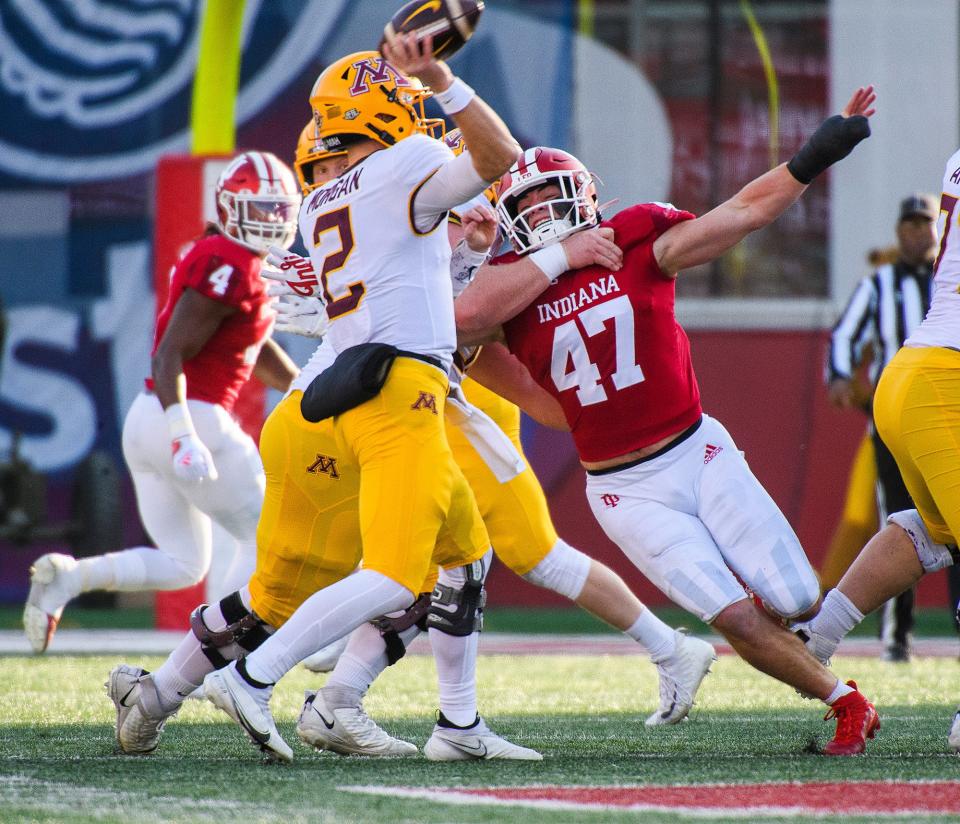 Indiana's Micah McFadden (47) battles to pressure Minnesota's Tanner Morgan (2) during the first half of the Indiana versus Minnesota football game at Memorial Stadium on Saturday, Nov. 20, 2021.