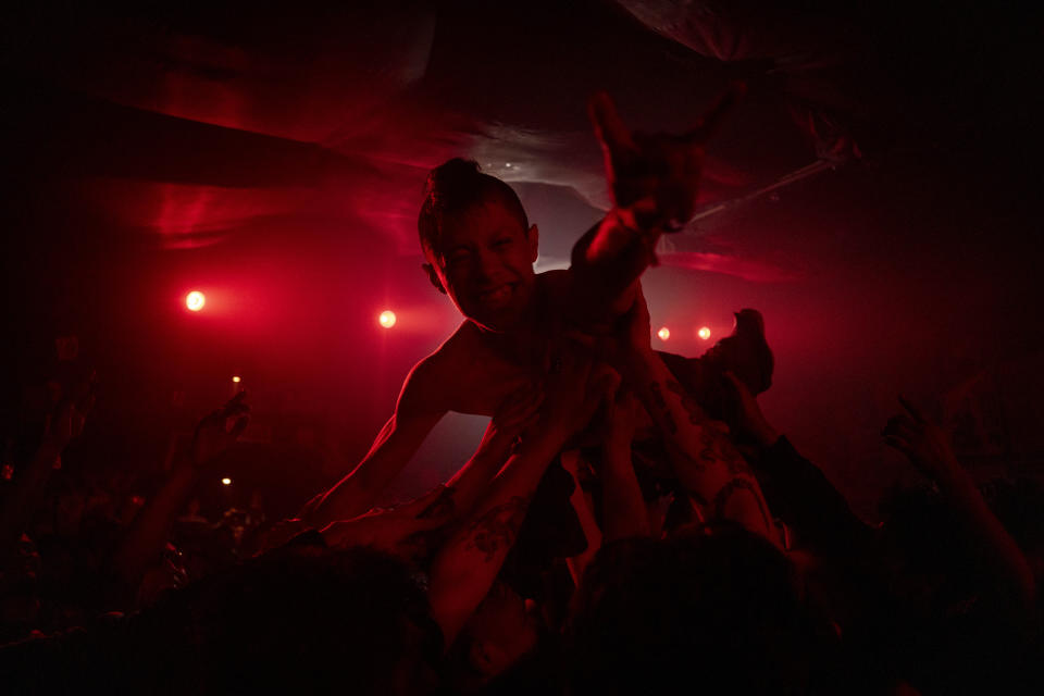 Fans of the Mexican Punk Rock band Seguimos Perdiendo dance during one of the last active weekends at the iconic counterculture venue Multiforo Alicia in Mexico City, Friday, Feb. 17, 2023. After 27 years, Multiforo Cultural Alicia closed its doors forever. For many, it marks an end of an era, and a sign of the toll gentrification has taken on the city in recent years. (AP Photo/Eduardo Verdugo)