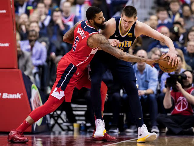 <p>Scott Taetsch/Getty</p> Markieff Morris defends against Nikola Jokic in 2018