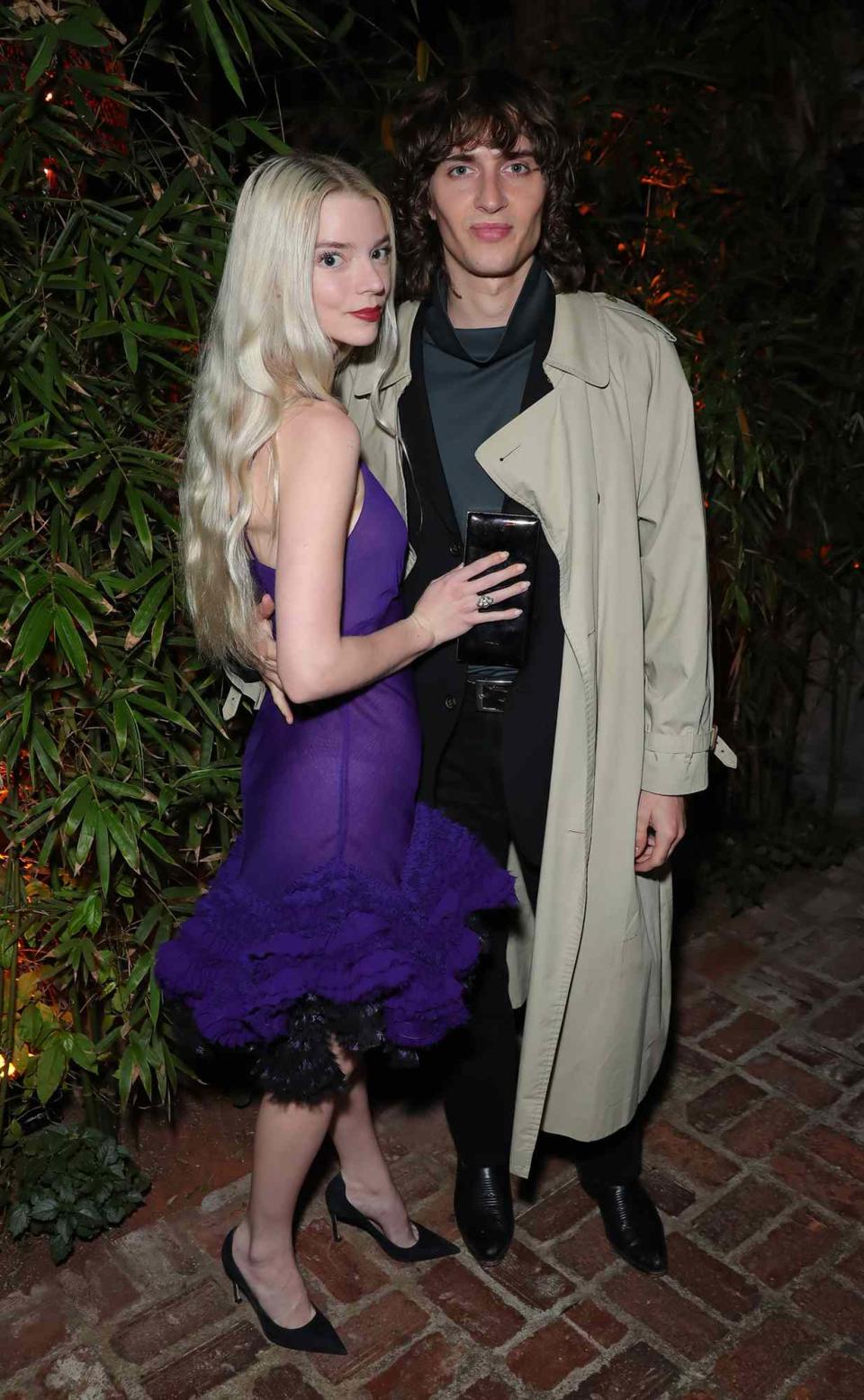 Anya Taylor-Joy and Malcolm McRae attend the CAA Pre-Oscar party at San Vicente Bungalows at San Vicente Bungalows on March 25, 2022 in West Hollywood, California