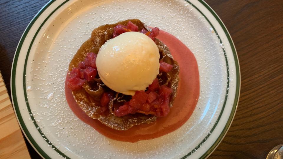 On the dessert menu at Corktown's Alpino is the Rosette, a crispy vanilla fritter with apple butter and honey crisp apple relish, topped with a scoop of vanilla Guernsey Farms Dairy ice cream.