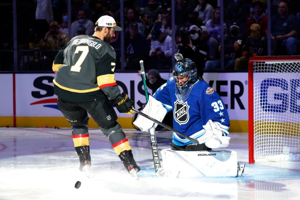 Manon Rheaume smiles after saving a shot on goal from Vegas Golden Knights forward Alex Pietrangelo.