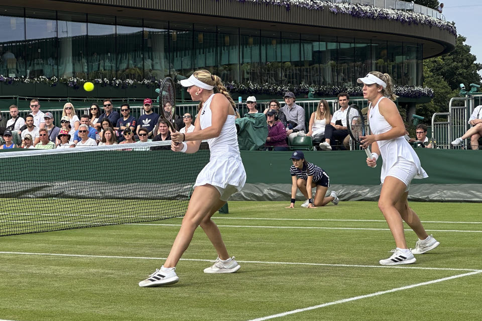 Caty McNally, right, and Ashlyn Krueger of the United States play against Caroline Garcia of France and Luisa Stefani of Brazil in a first-round women's doubles match at Wimbledon on July 8, 2023. McNally, a 21-year-old tennis player from Ohio, was one of six of 128 entrants in women's singles at Wimbledon who has a female coach, about 5%. The women's professional tennis tour hopes to increase the number of women coaching at the sport's top level and has started a program to help aspiring coaches get there. (AP Photo/Howard Fendrich)