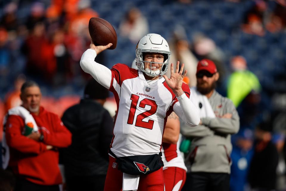 Arizona Cardinals quarterback Colt McCoy (12) warms up before the game against the Denver Broncos at Empower Field at Mile High on Dec. 18, 2022.