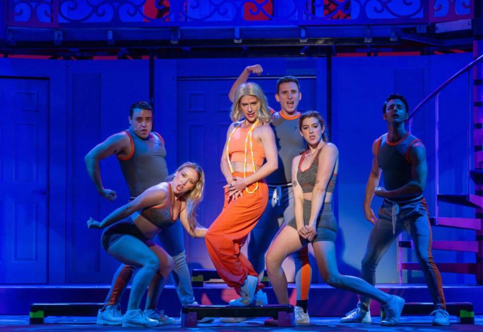 Stephanie White as fitness queen Brooke Wyndham, center, demonstrates her tough-love style in “Legally Blonde the Musical” at Actors’ Playhouse at the Miracle Theatre.