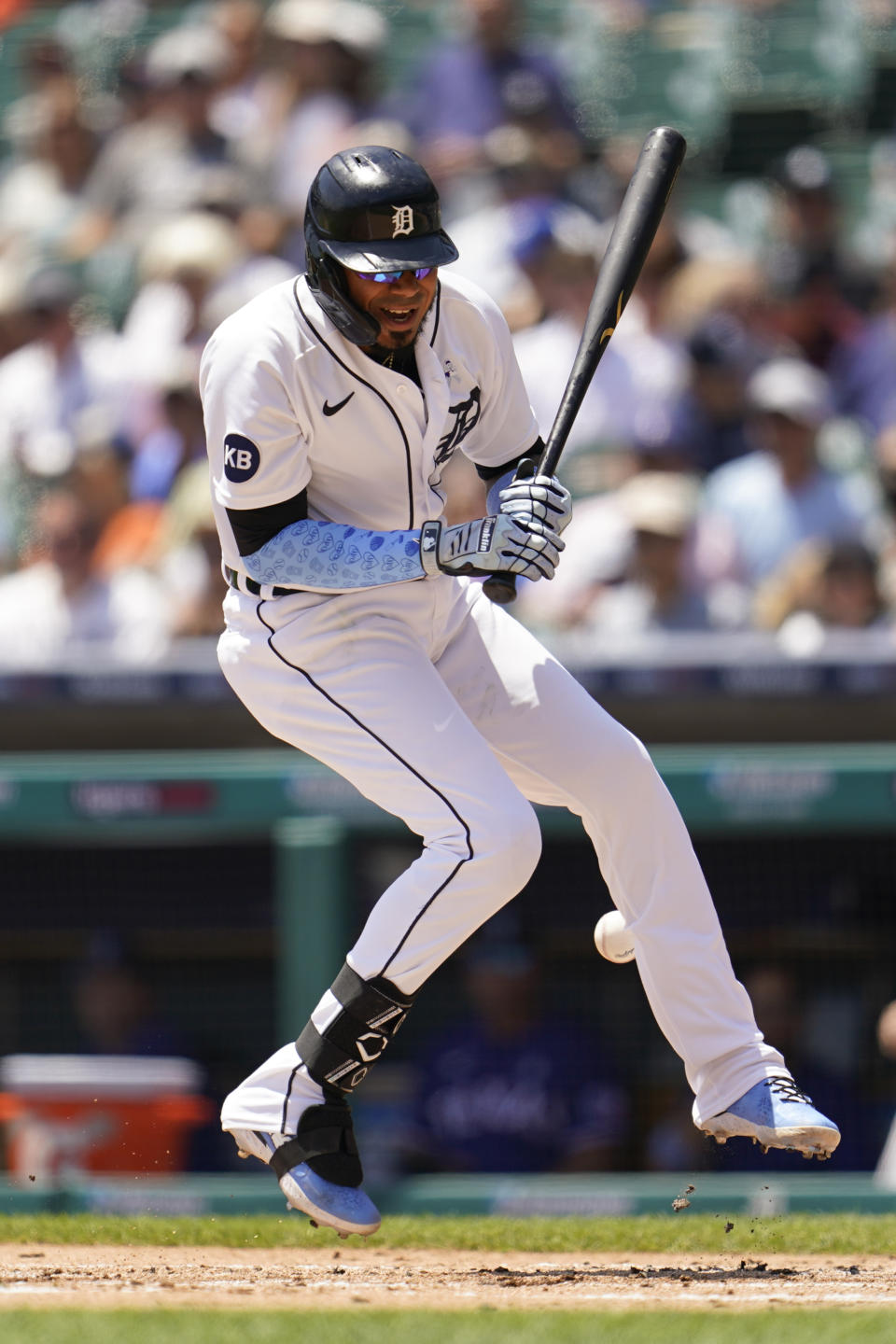 Detroit Tigers' Harold Castro reacts to being hit by a Texas Rangers pitcher Dane Dunning pitch in the first inning of a baseball game in Detroit, Sunday, June 19, 2022. (AP Photo/Paul Sancya)