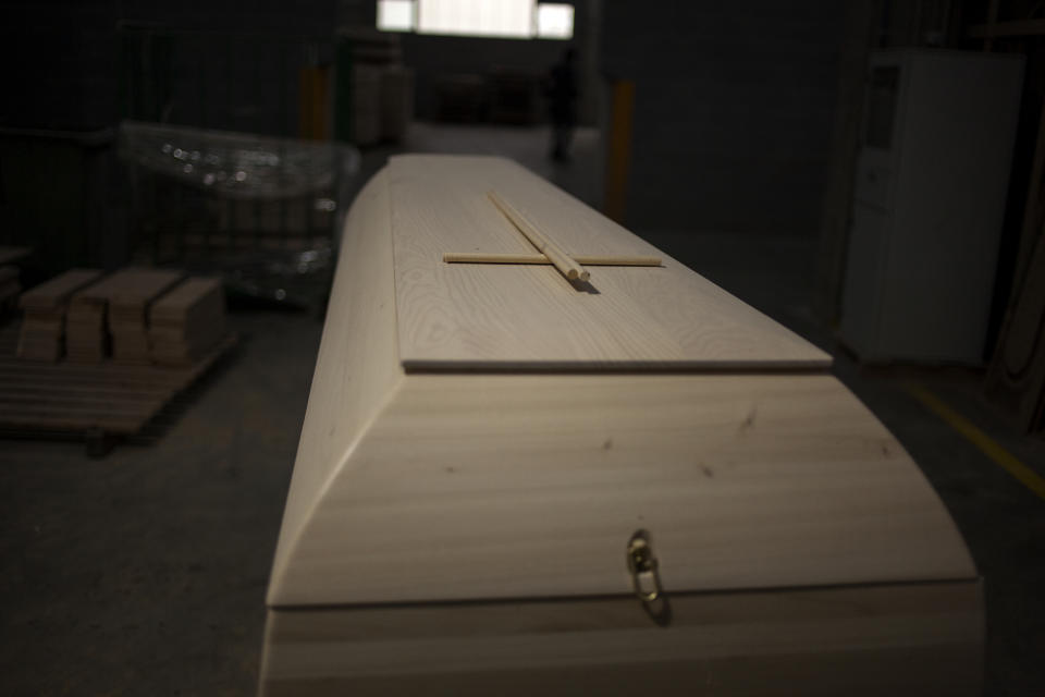 An unfinished coffins sit at the Eurocoffin coffins factory in Barcelona. (José Colon for Yahoo News)