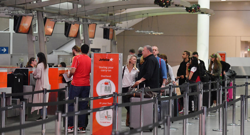 Jetstar pilots are preparing to undertake four-hour work stoppages on Sunday. Pictured is a stock image of the airline's passengers at the check-in counter in Sydney.